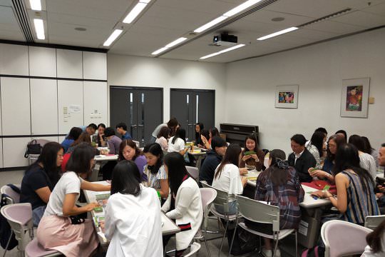 Teachers were in groups with tutors to carry out board games demonstration teaching and reflective activities.