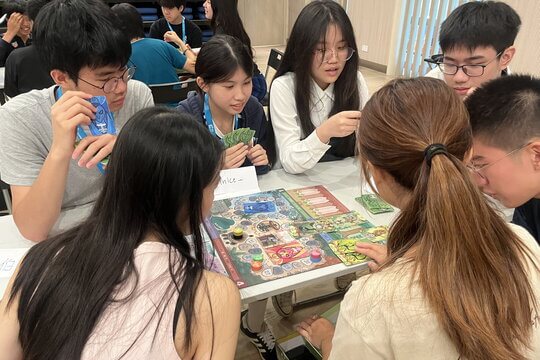 Tutors guided students in small groups to experience the engaging and thrilling board game