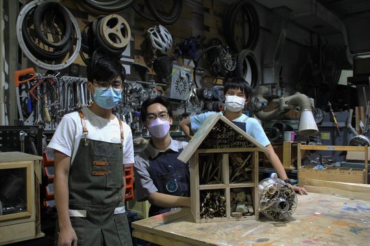 The architects of the insect hotel with their masterpiece.