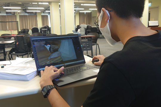 The student is using 3D modelling to produce the pieces to be used in the boardgame they designed.